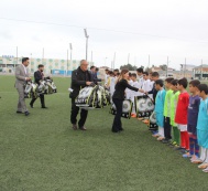 Sports implements are presented to teenage footballers on behalf of Leyla Aliyeva 